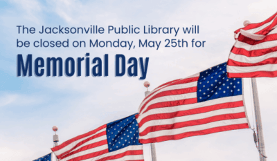 Image: the background is a photograph of a blue sky, white clouds, and American flags waving. Text reads: The Jacksonville Public Library will be closed on Monday, May 25th for Memorial Day.